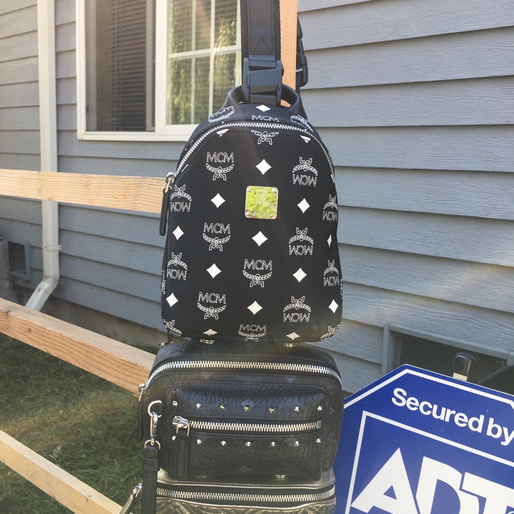 Authentic MCM black 4tray in 1 backpack crossbody.
